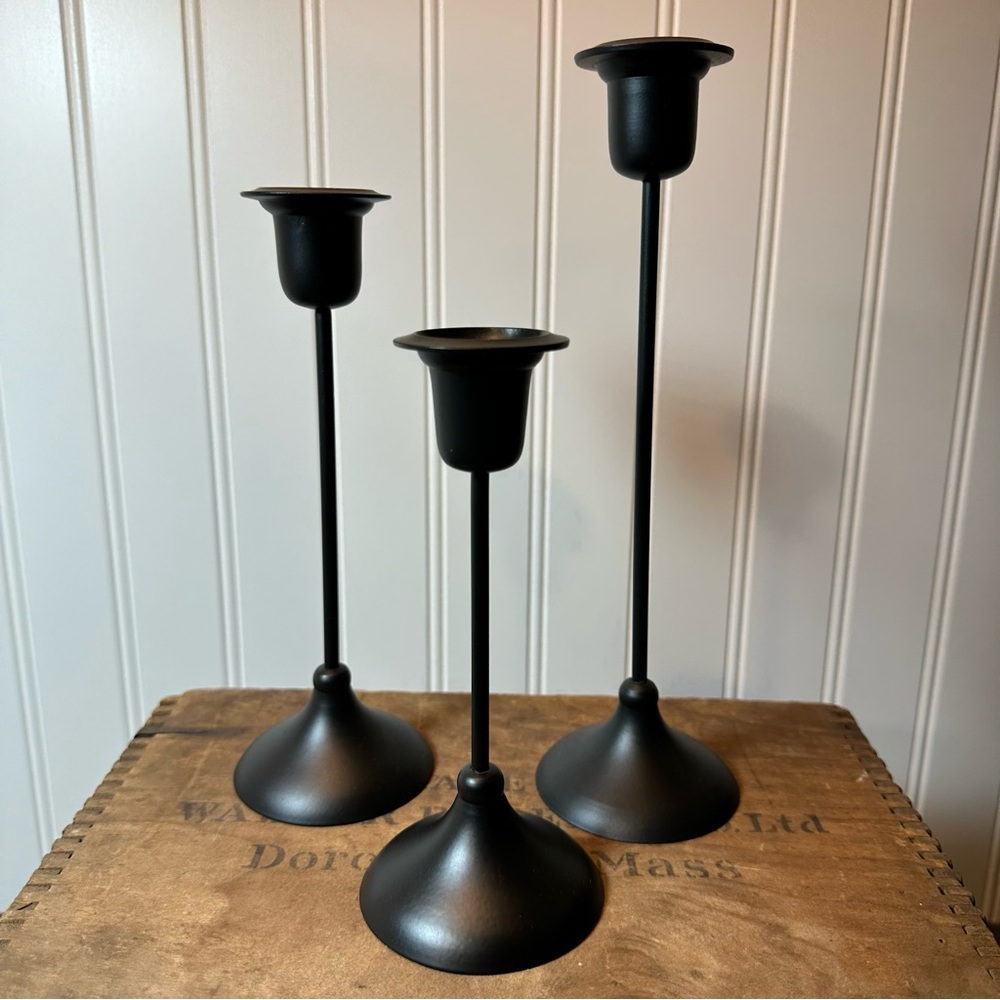 Three Vintage Graduated Black Metal Candlesticks